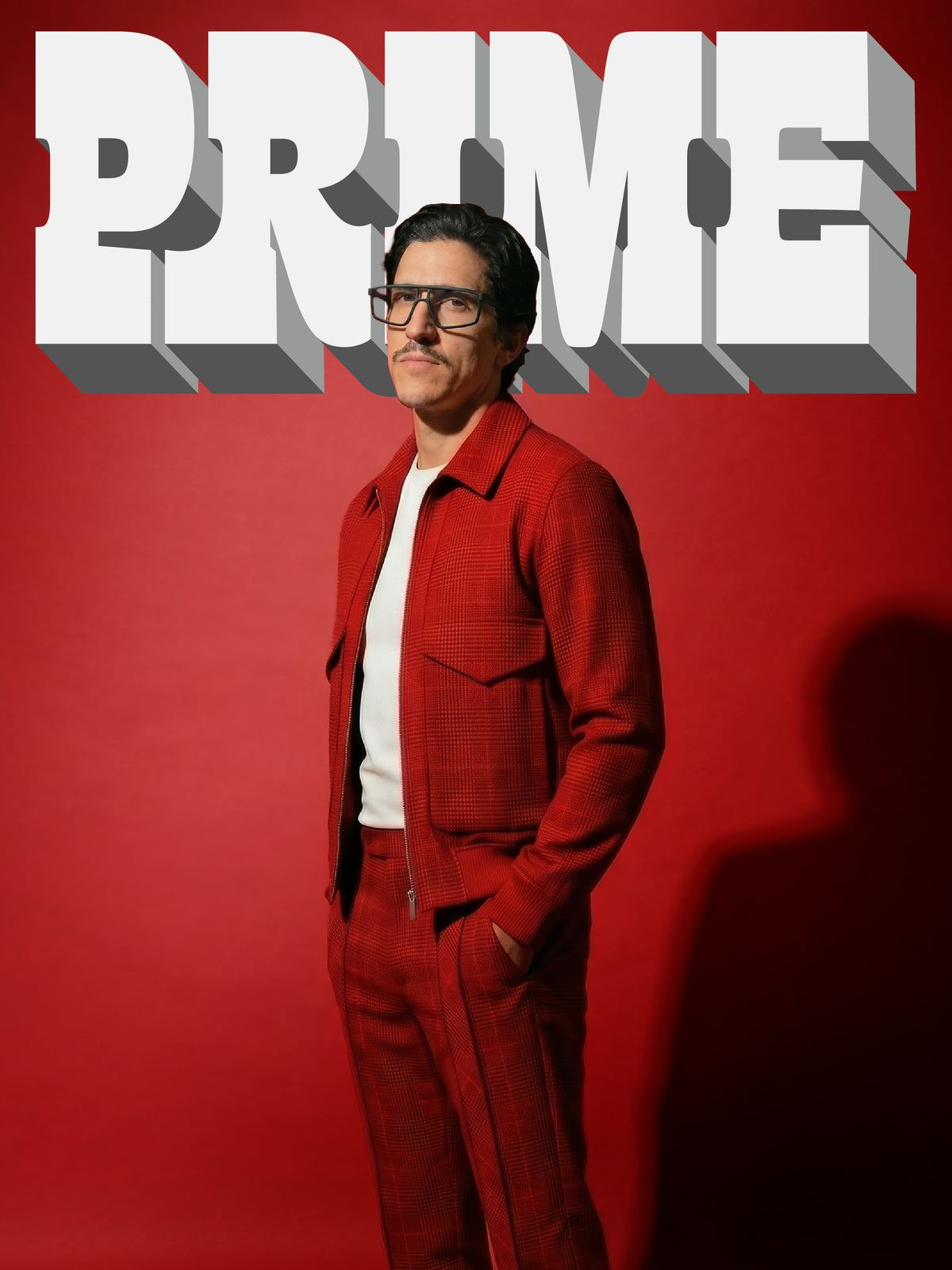 Prime campaign cover: model in a red check jacket wearing Blynq Prime structured rectangular glasses in Black Main image